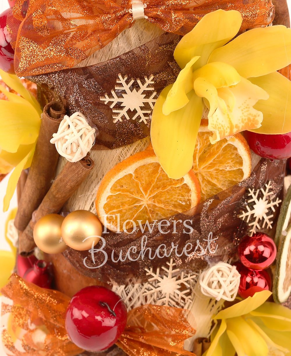 yellow cymbidium, cinnamon, dried oranges, apples, stars, cones, decorations