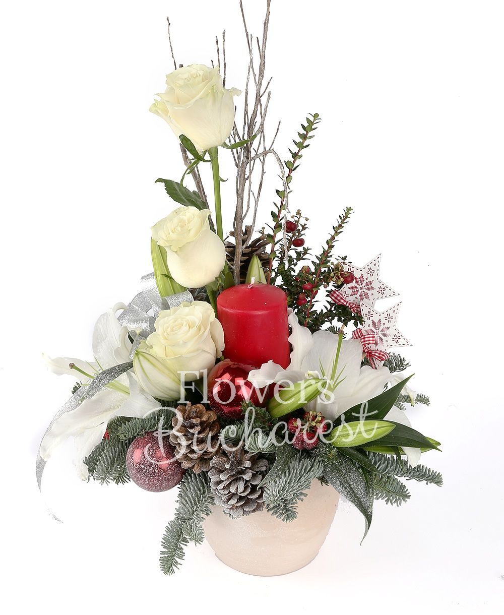 1 white lily, 3 white roses, 2 red hypericum, cones, globes, candle, greenery