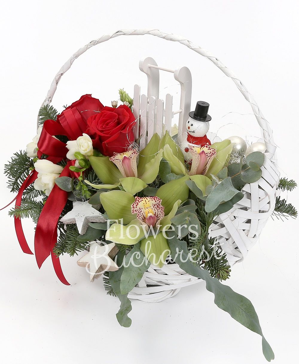 3 red roses, 3 cymbidium, 5 freesias, 1 white lisianthus, waxflower, greenery, silver fir, christmas decorations, basket